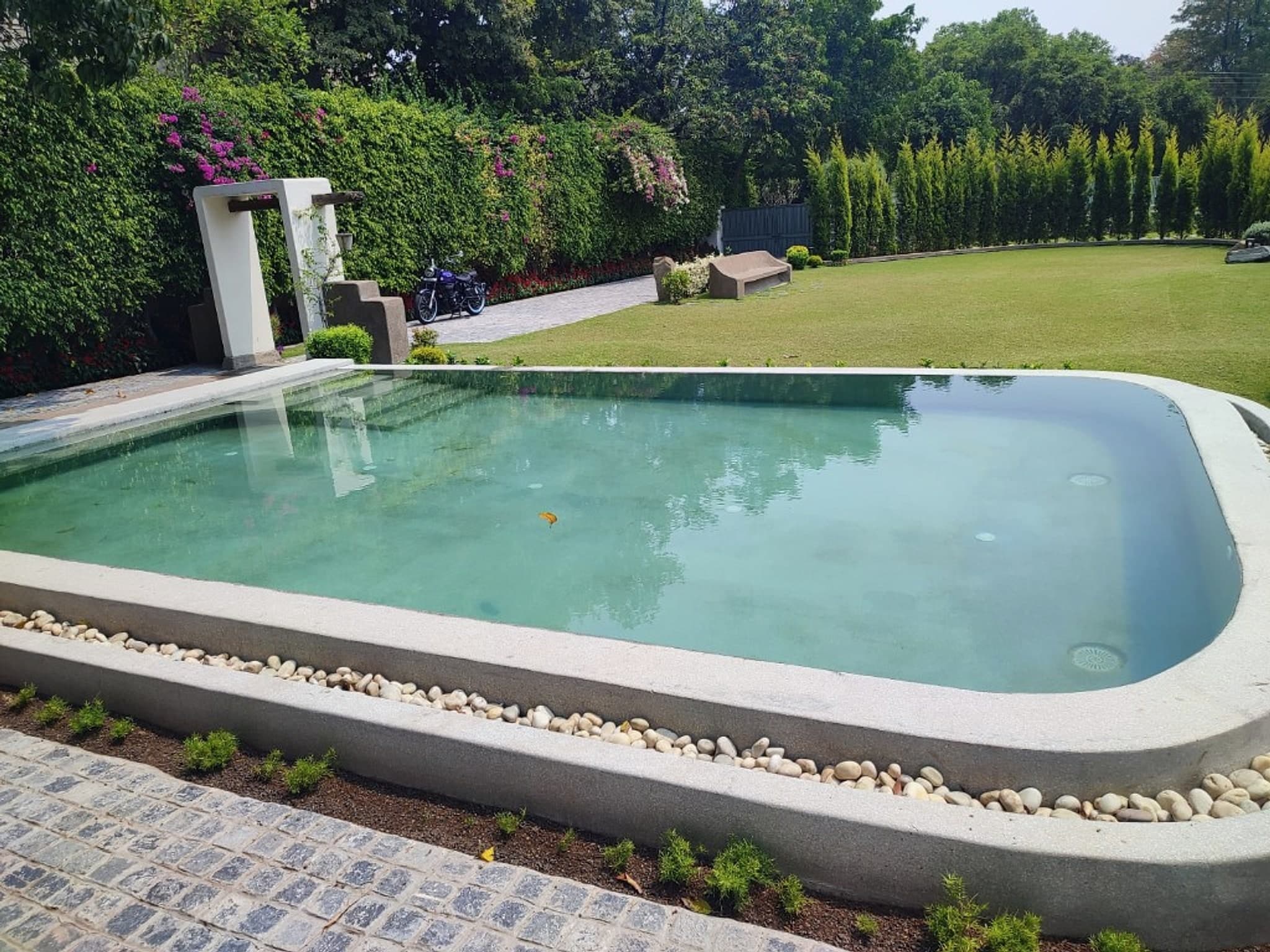 Premium private estate pool with manicured garden environment